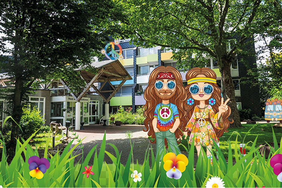 Zwei gezwichnete Hippies (ein Mann und eine Frau) sind vor dem Eingang eines Altenheims platziert worden.